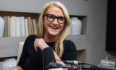 Mel Robbins stretching in morning light