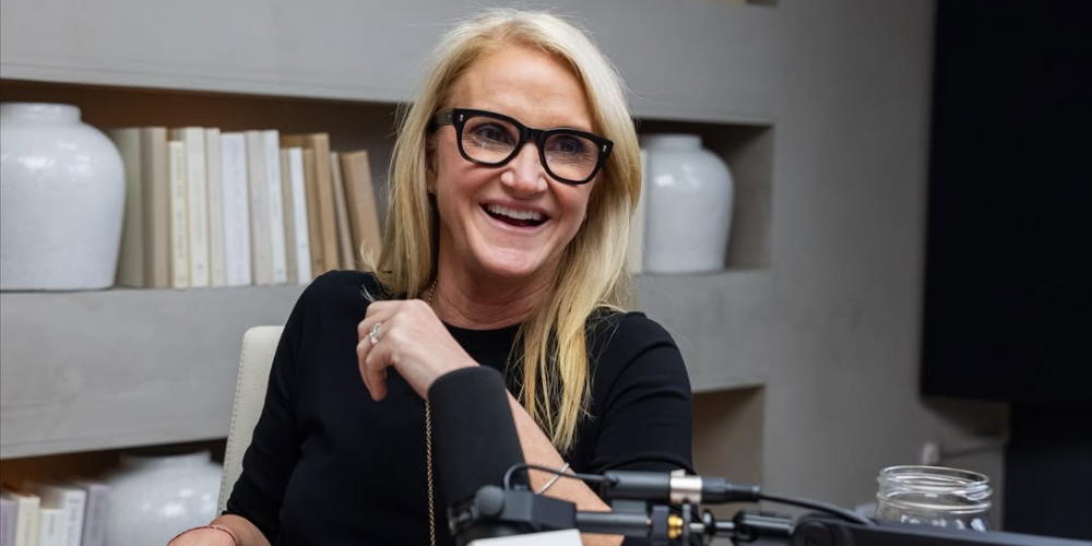 Mel Robbins stretching in morning light